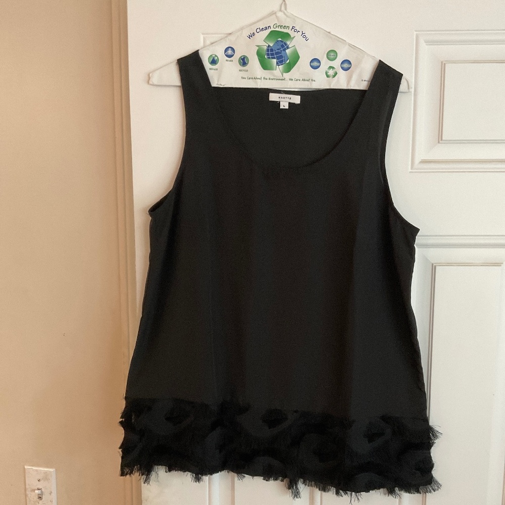Women’s top sleeveless with feather trim